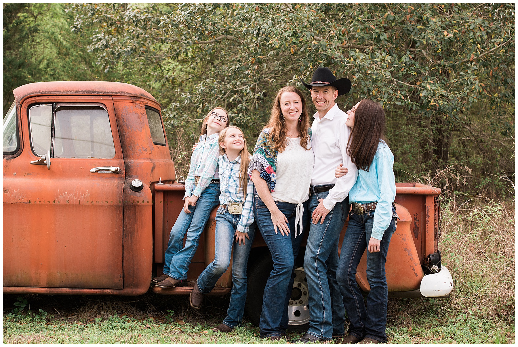 outdoor family ranch portraits beside a truck 